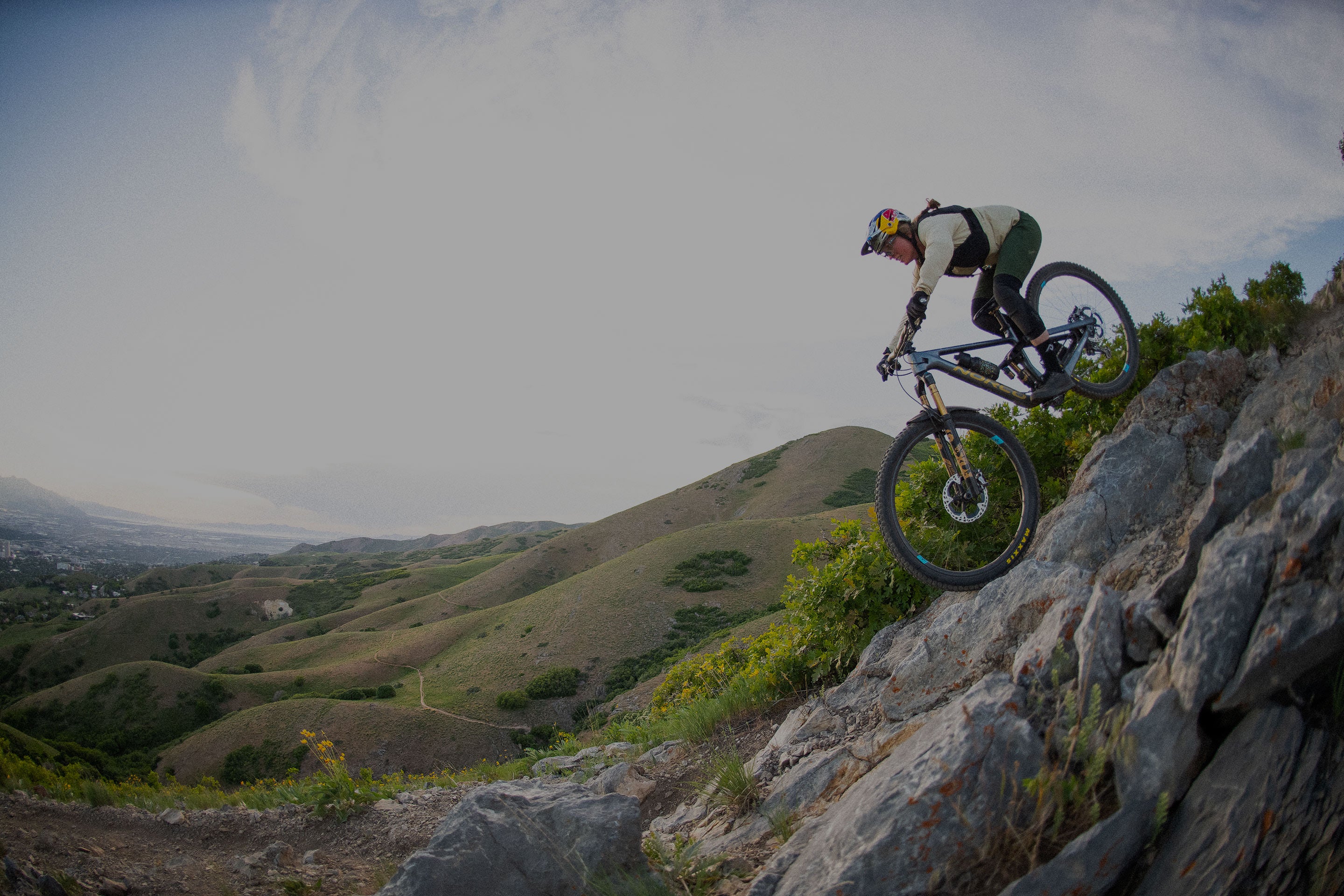 Mike Emery riding bike down a rock side of a mountain in Utah