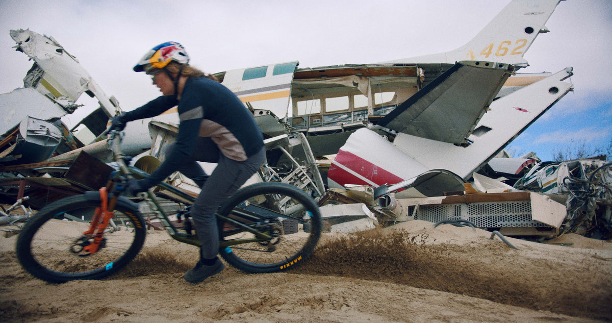 Biker Riding Enduro MTB Wheelset in Front of Plane